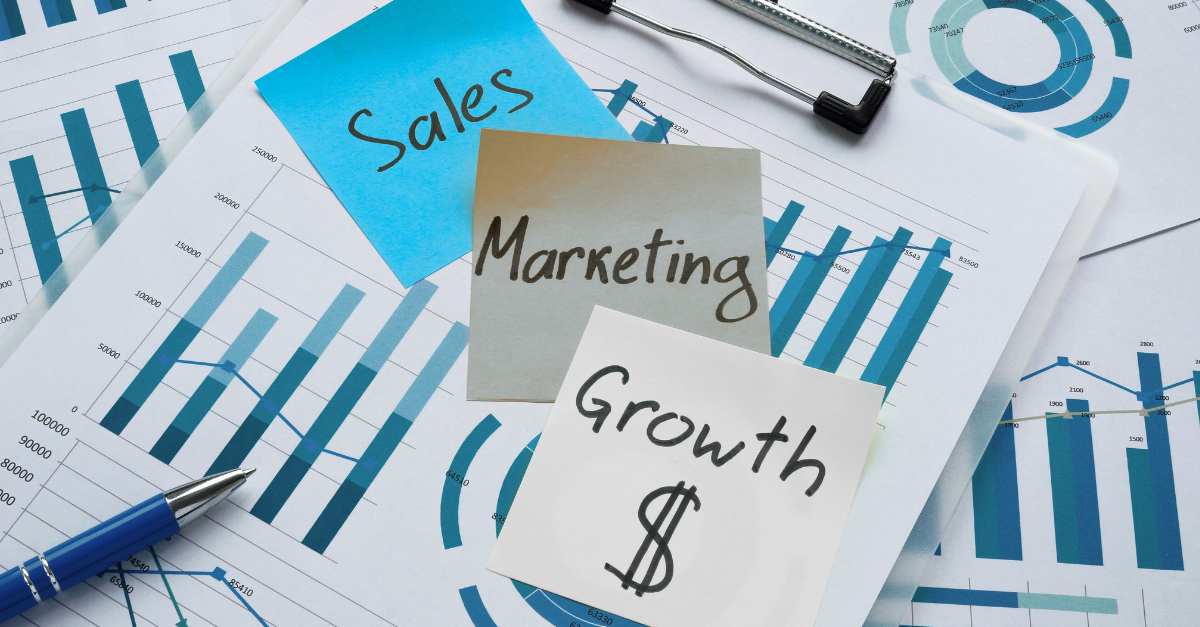 Sales, marketing, and growth notes displayed over financial charts and graphs.